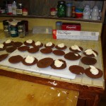 Whoopie pies laid out on the counter with cream filling