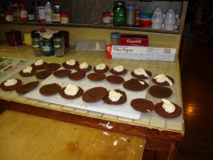 Whoopie pies laid out on the counter with cream filling