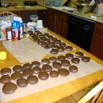 Whoopie pie cakes laid out on the table with filling
